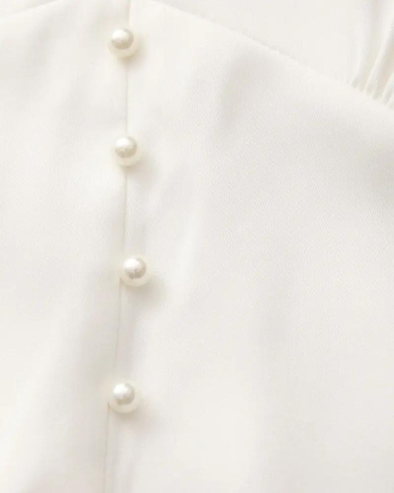 Robe midi à volants et boutons nacrés